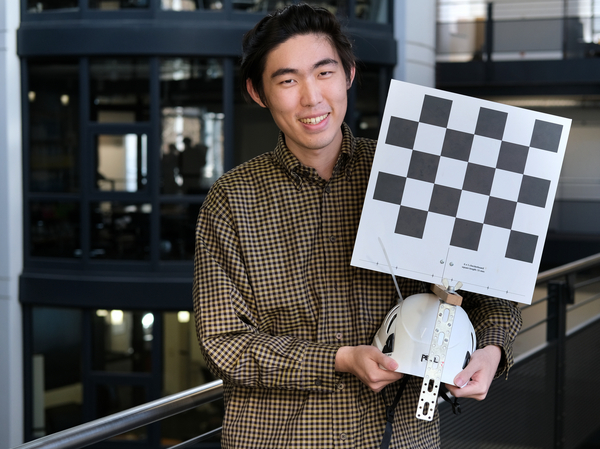 Jianchun Chen, PhD student at MPI for Informatics and first author of "EgoAvatar" presents the research prototype of the head-worn camera-setup. Photo: Philipp Zapf-Schramm/MPI-INF